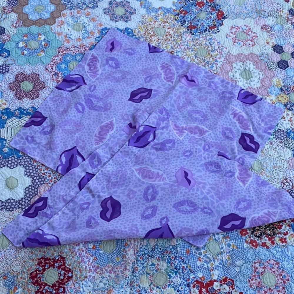 A Set of Two Purple Sham Covers. Says Kiss Me